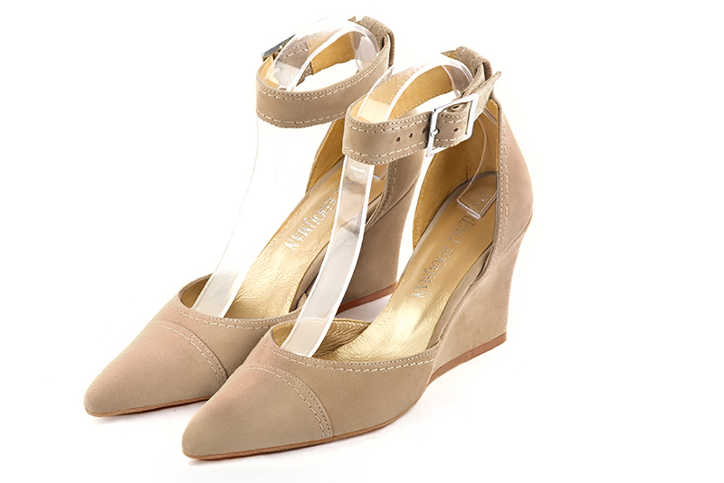 Tan beige women's open side shoes, with a strap around the ankle. Tapered toe. High wedge heels. Front view - Florence KOOIJMAN